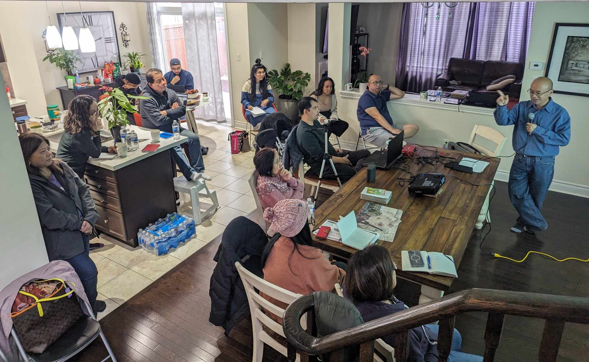 An FCC small group studying the Bible together in a home