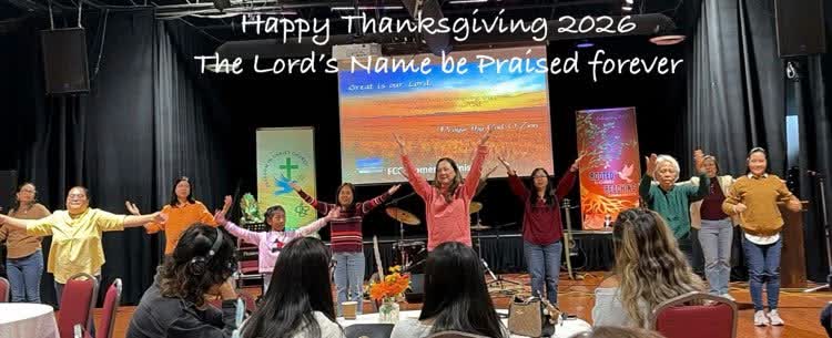 The congregation worshipping in front of a "Happy Thanksgiving 2026" slide